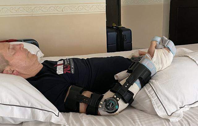 Eric Greager rests in a Mexico hotel room after a vicious crocodile attack while swimming in the ocean in front of his hotel in Cozumel, Mexico. 